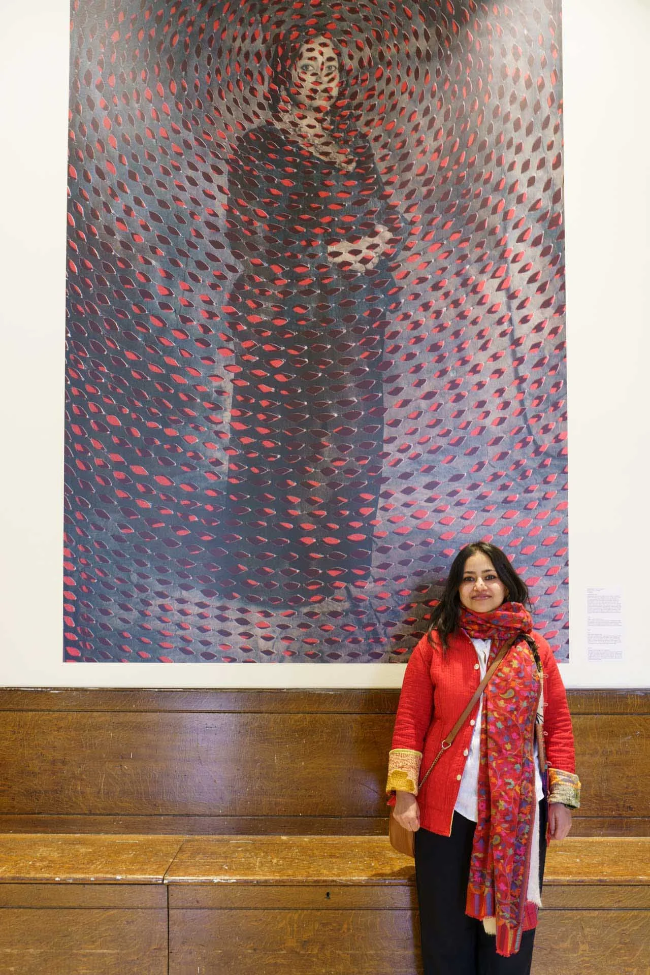  Sujata Setia stands beneath one of the powerful images in her series A Thousand Cuts. 