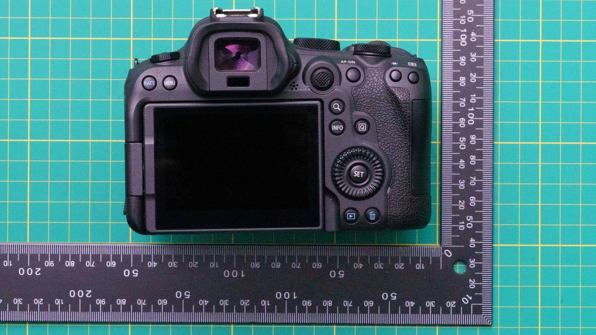  The eye sensor beneath the viewfinder detects when the camera is held to your eye to swithc between the viewfinder and screen.  