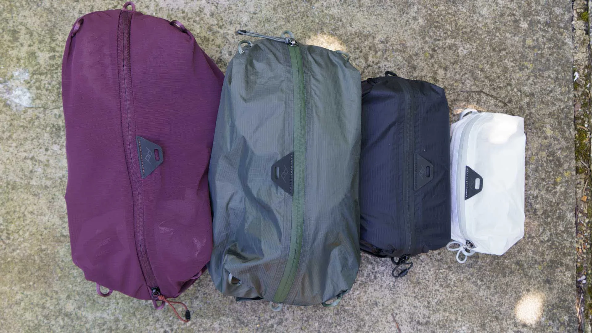  From left to right, the Peak Design Ultralight Packing Cubes in size Small (mesh), Small (regular), X-Small (regular) and XX-Small (regular). 