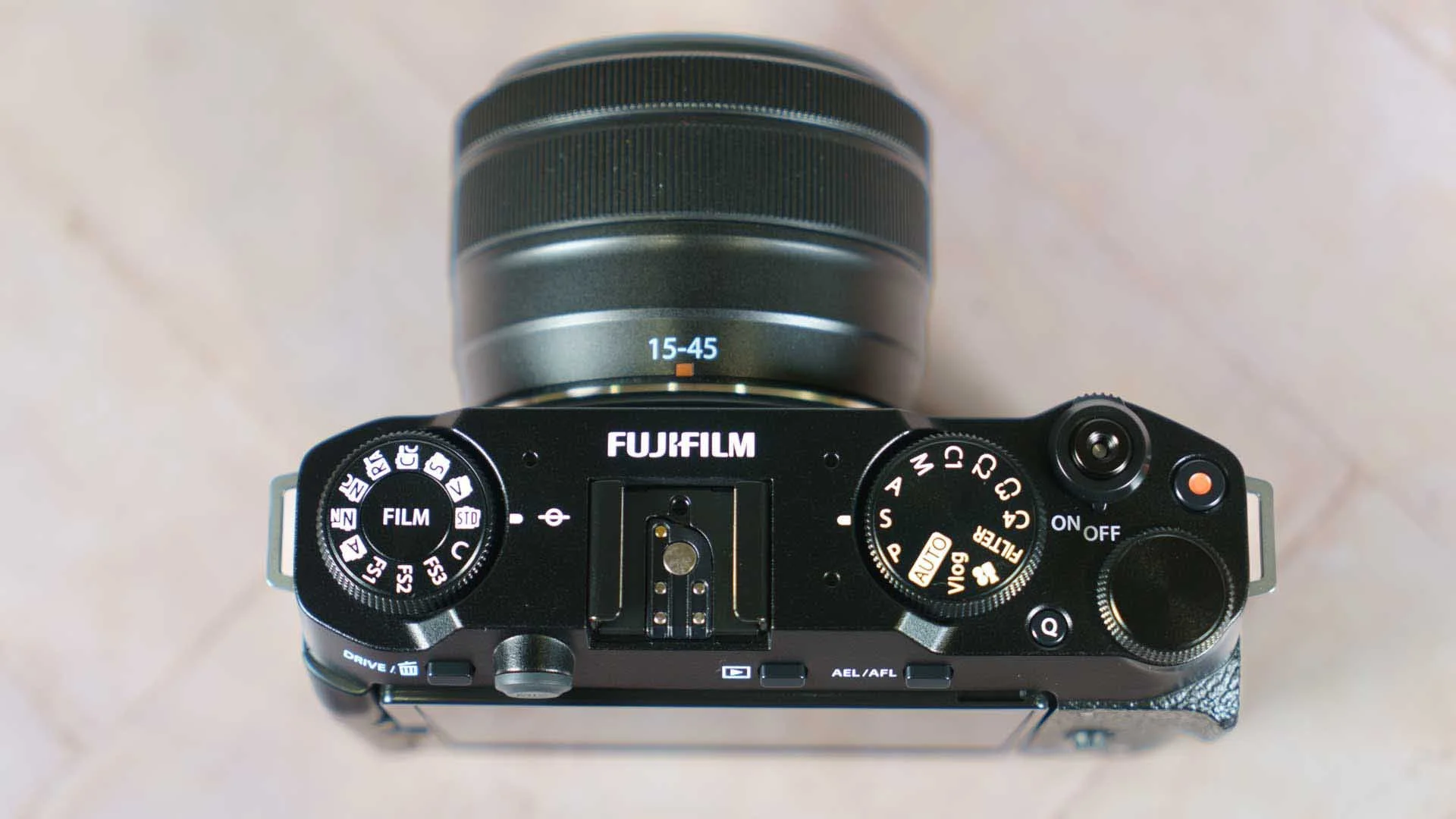  The Q button on the Fujifilm X-M5's top-plate is used to access the customisable Quick menu. It's easy to fins with your finger when your looking at the rear screen. 