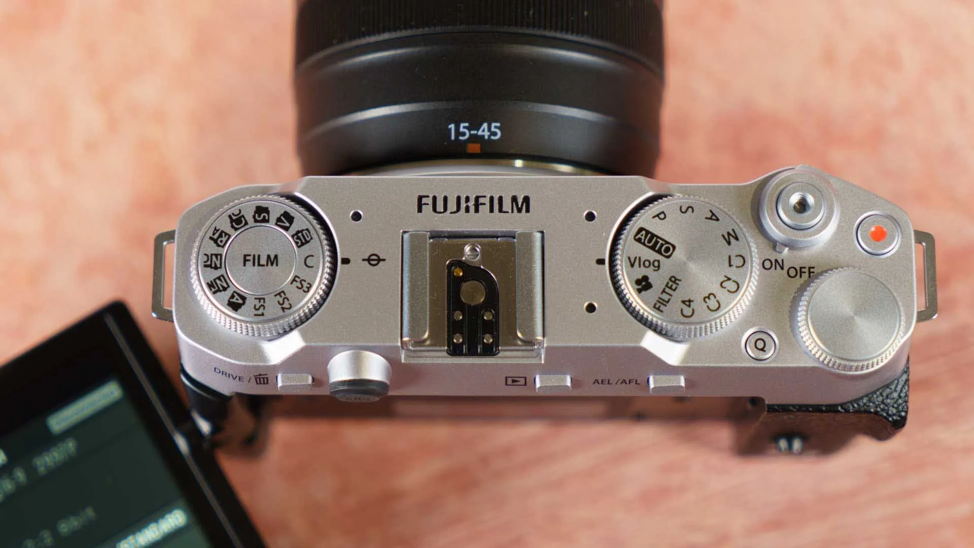  The Film Simulation Mode dial is on the lfet of the X-M5's top-plate while the exposure mode dial is on the right. 