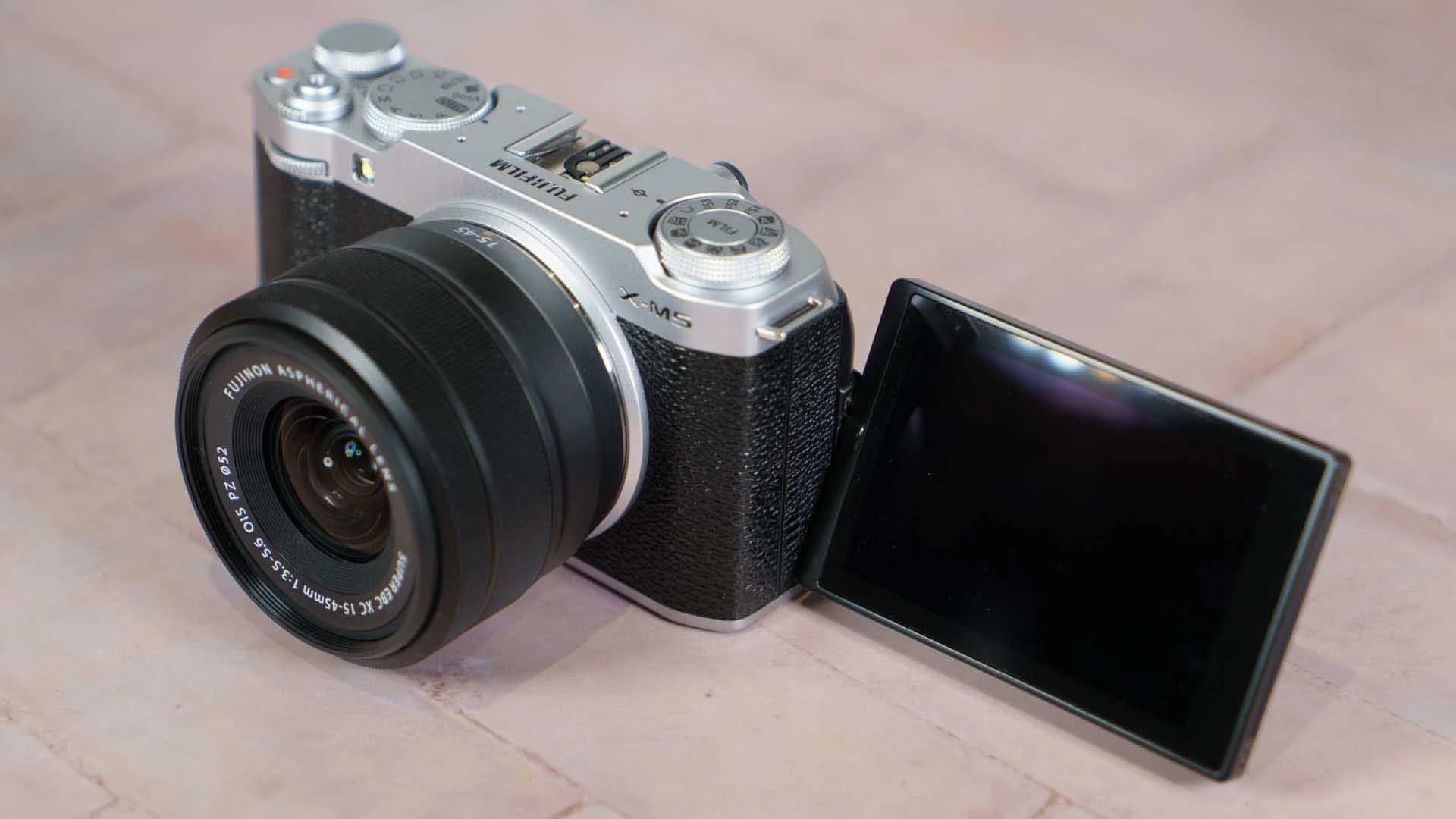  The Fujifilm X-M5 has a 3-inch, 1.04-million-dot touch screen on a vari-angle hinge for composing and reviewing images or videos. The screen can be flipped out the side of the camera and angled up or down, or rotated to face forwards. 