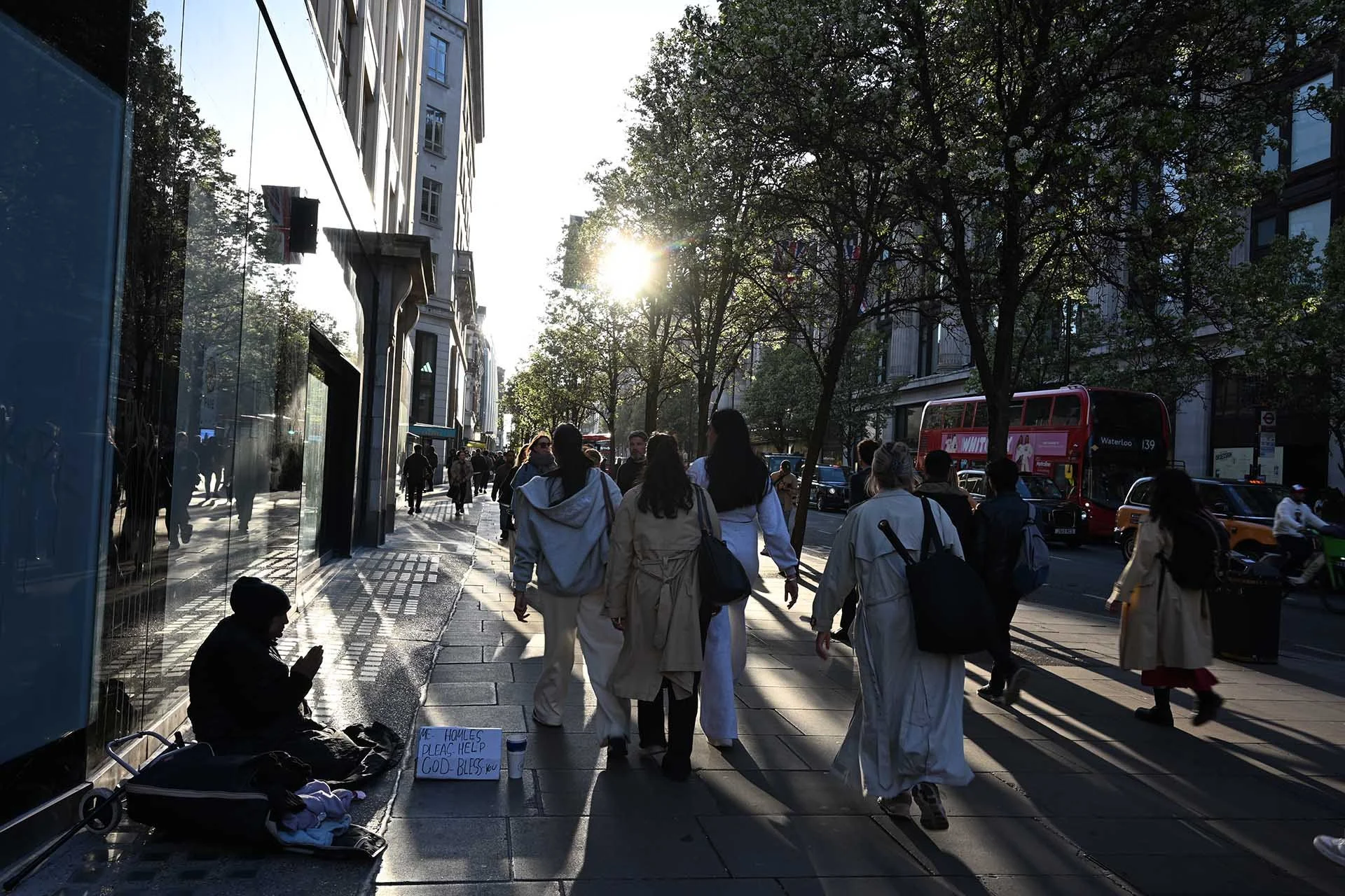 Image Credit: Angela Nicholson. The strong backlighting created interesting shadows and silhouettes in this street scene. The camera had no problem focusing and the lens controlled flare very well. Camera Z5II, lens Nikkor Z 26mm F2.8 at f/8, 1/80 sec and ISO 100.