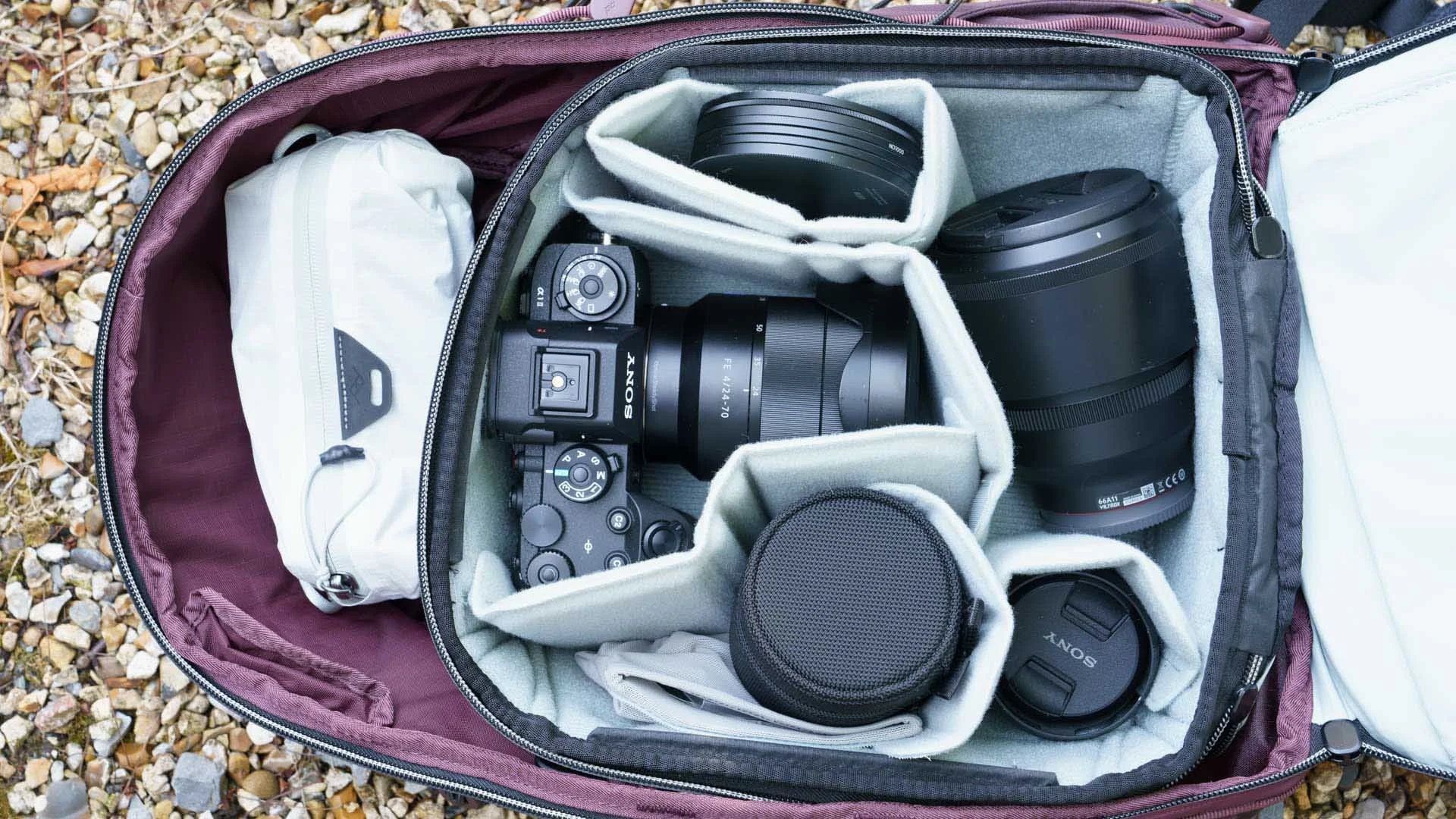  The Smedium Camera Cube fits in neatly and has room for a modest full-frame set-up, including a 70-200mm f/2.8 on or off a camera. You can also fit in an X-Small Camera Cube above it, but I opted for an XXS Ultralight Packing Cube to hold items like spare batteries, SheClicks badges, a USB cable and other small bits and bobs. 