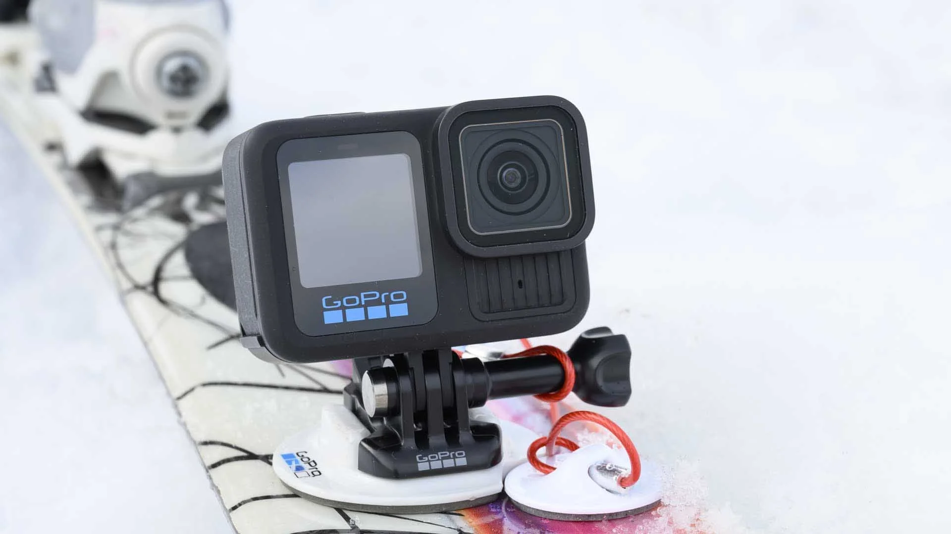  GoPro’s Surfboard Mount comes with a second sticky pad for attaching a tether.  You can make a tether from a length of kite string or fishing line, or buy something from Amazon.  