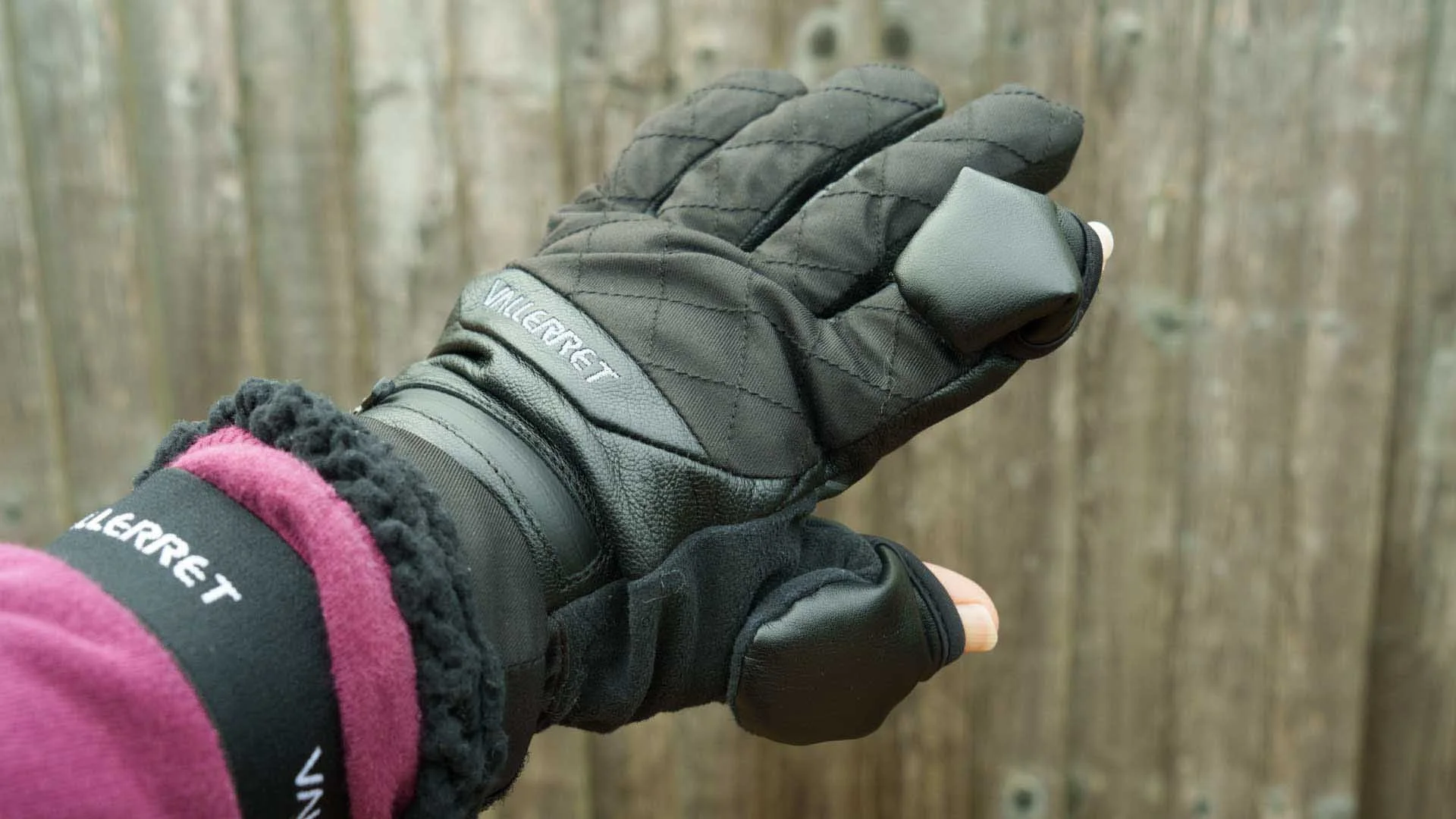 The finger caps cover much of the back of my thumb and forefinger when they are flipped back.