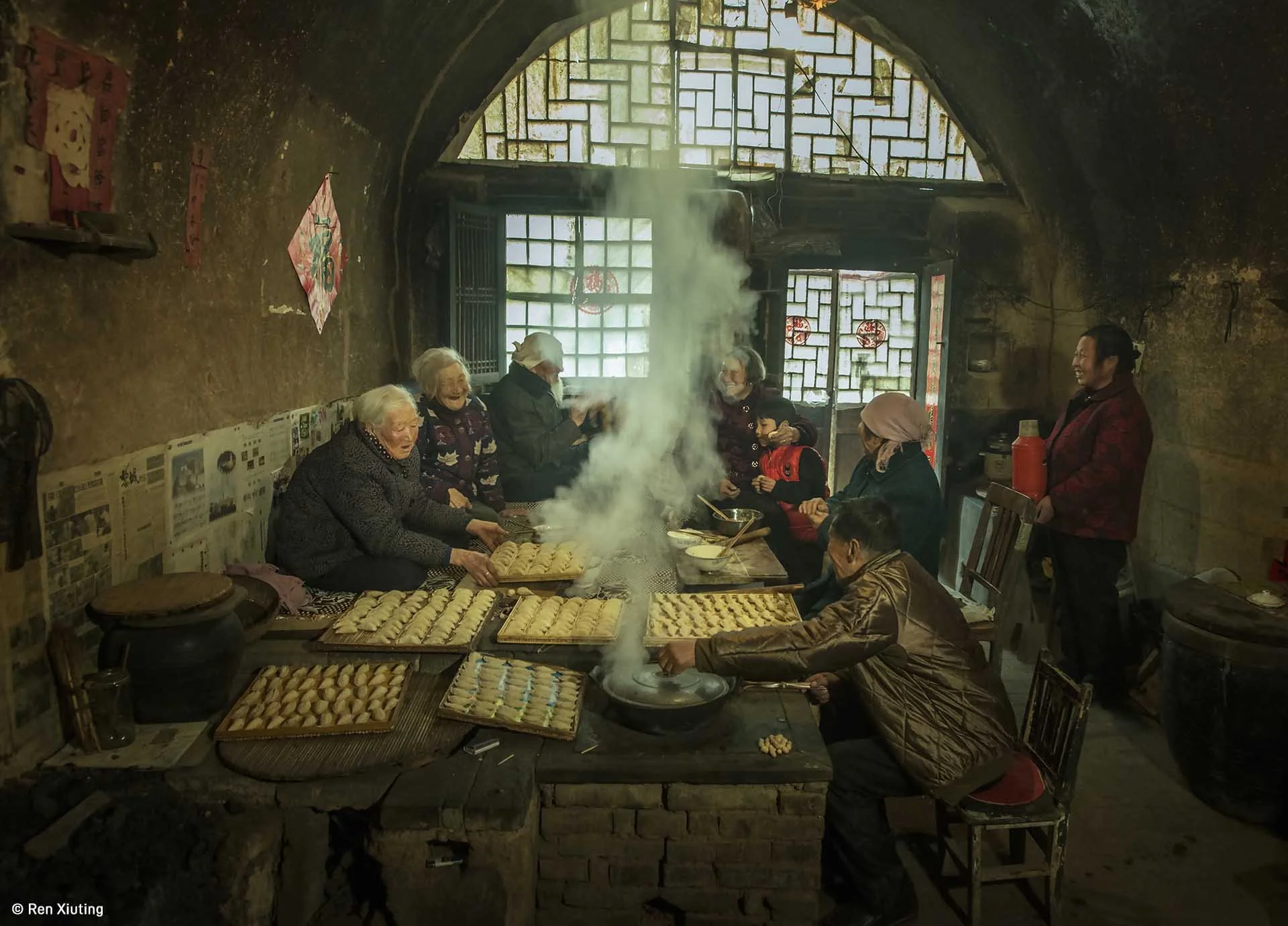  Image credit: Ren Xiuting	New Year in Old Cave Dwelling	Photographed in Licheng County, Shanxi Province. During the Chinese New Year, families gather around to make dumplings and have a good time talking and laughing. 