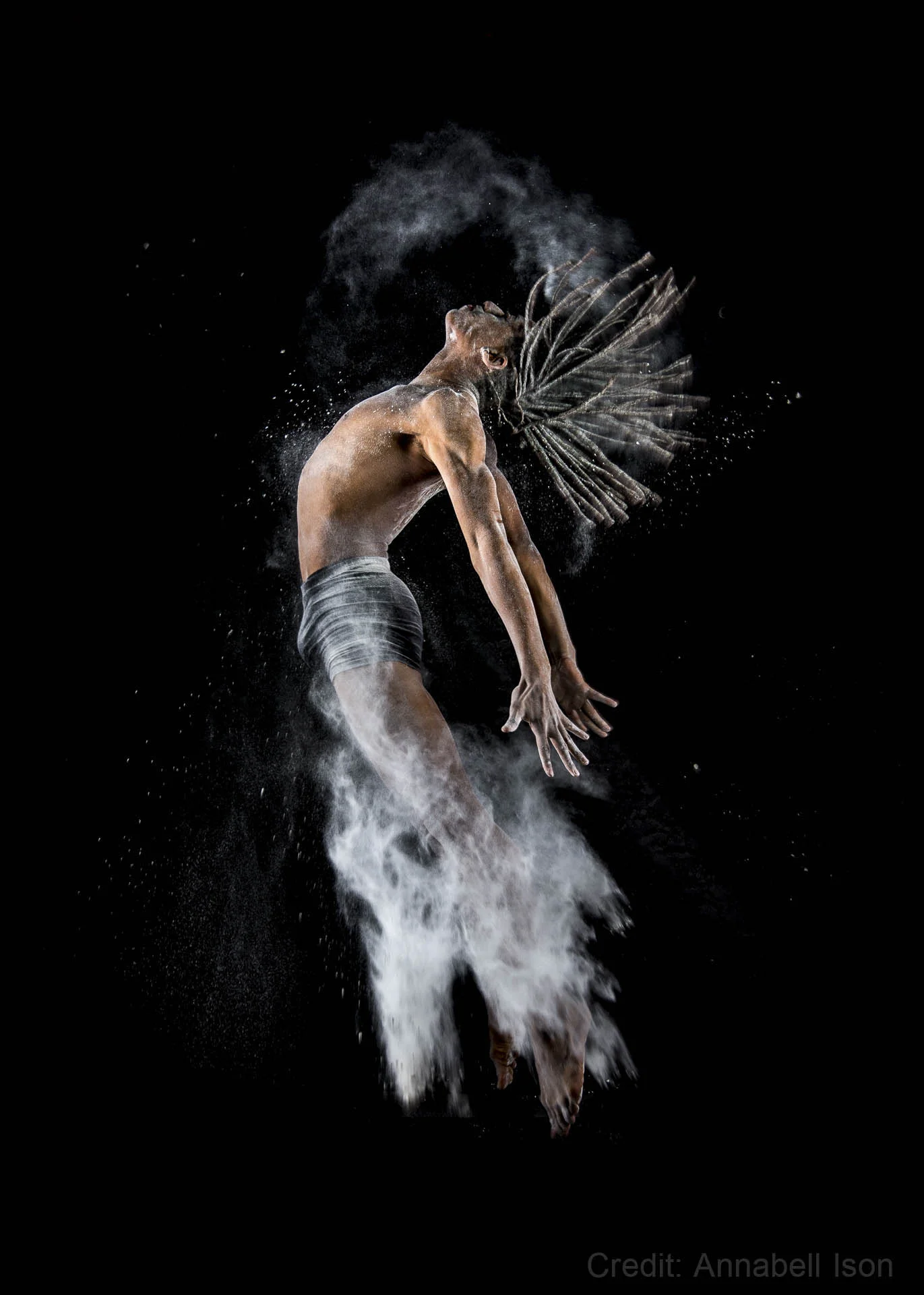 Male dancer leaping with flour