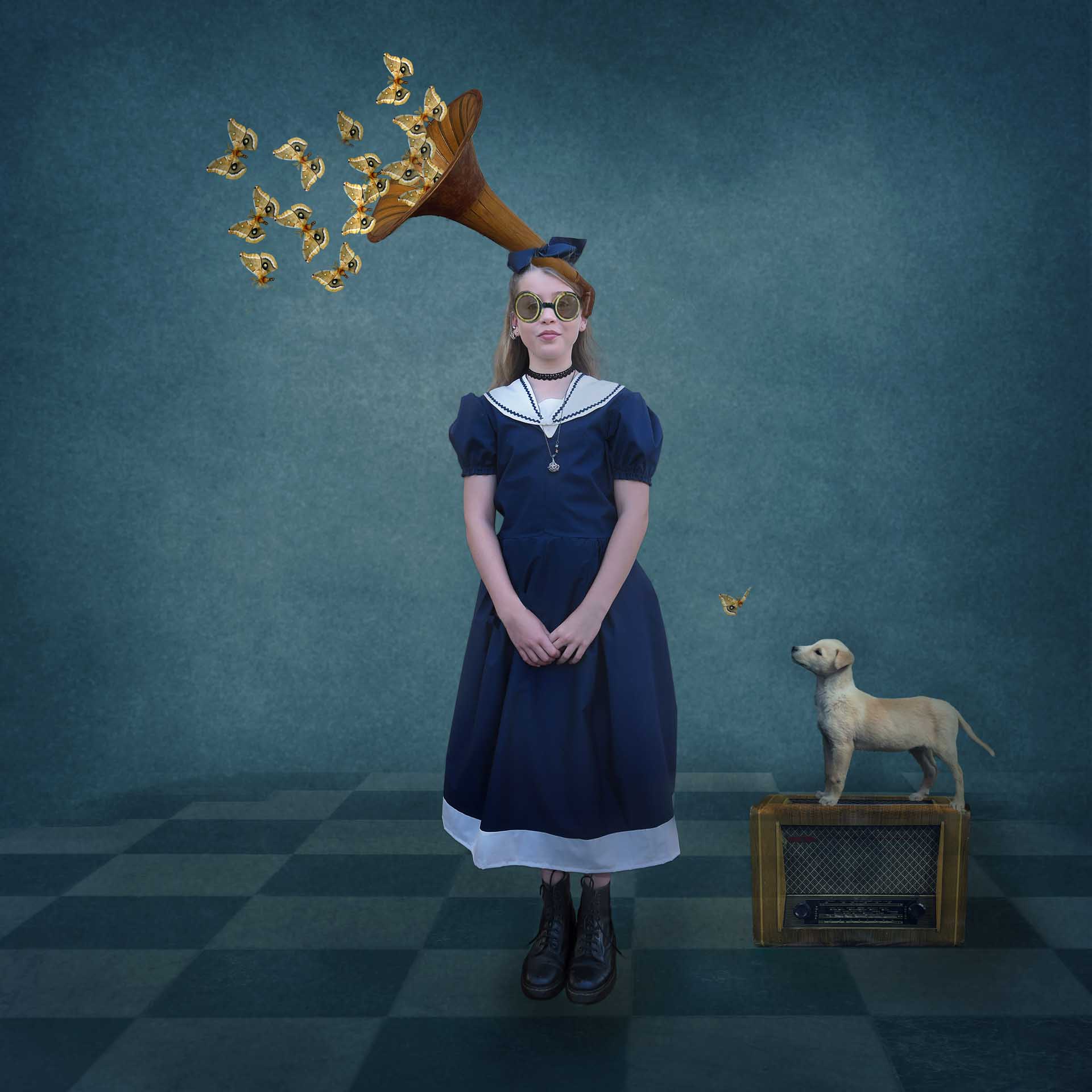 Girl in a vintage blue dress with round goggles, a horn-shaped device on her head releasing butterfly-like shapes, and a small dog beside her.