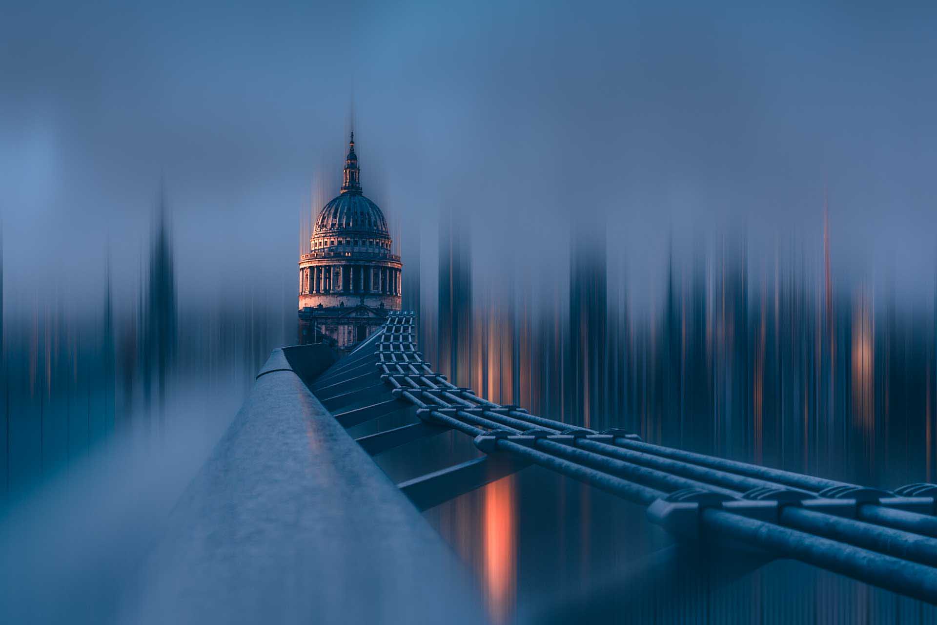 View along Millennium bridge or walkway leading toward a domed cathedral, with vertical motion blur creating a surreal cityscape.