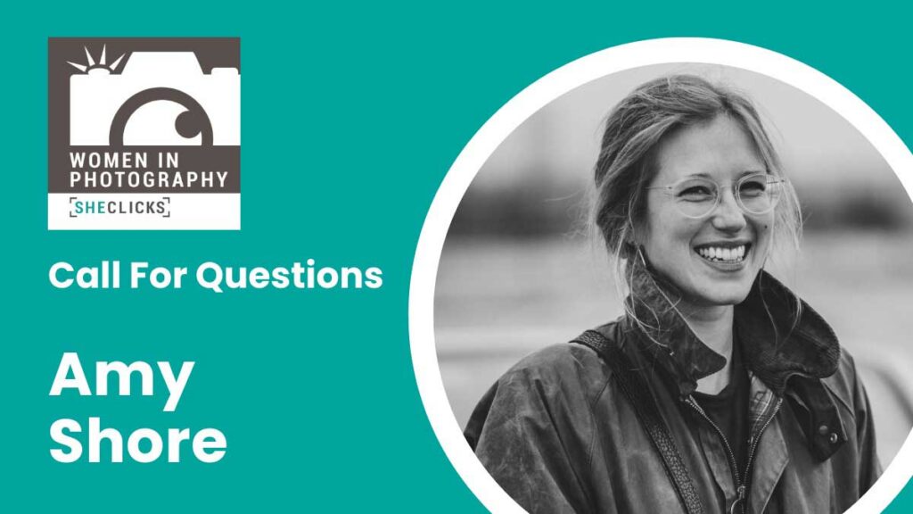 Women in Photography SheClicks logo beside text reading “Call For Questions Amy Shore” on a teal background, with a black-and-white portrait of a smiling woman wearing glasses and a dark jacket inside a circular frame.