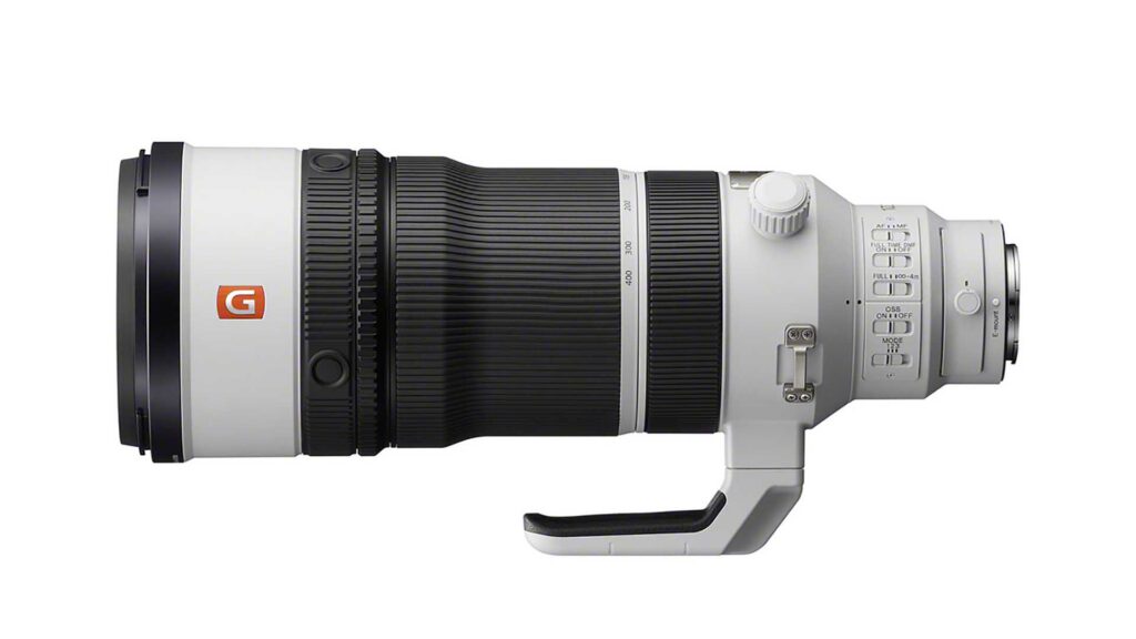 White Sony FE 100-400mm F4.5 GM OSS - a telephoto zoom lens with tripod collar and control switches shown from the side on a white background.