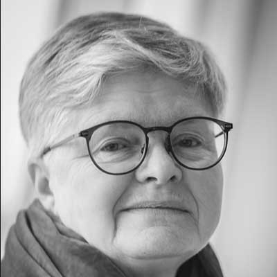 Gunilla Steen's profile picture in black and white - a fair-haired woman wearing round glasses