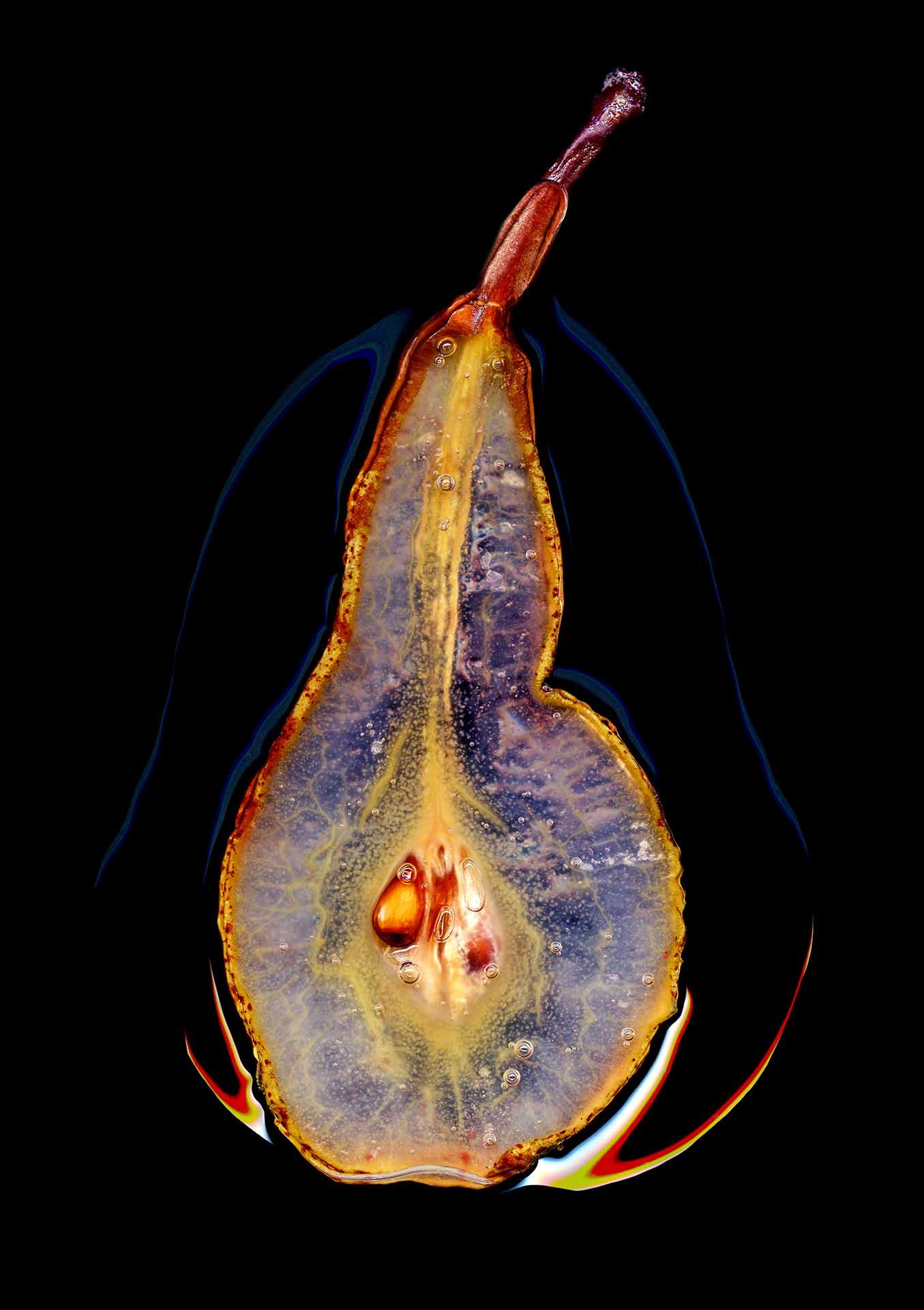 Translucent pear slice photographed on a black background, highlighting the seeds and internal structure.