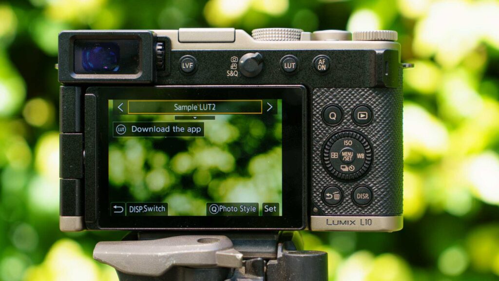 Rear screen of the Panasonic Lumix L10 displaying “Sample LUT2” with a prompt to download the app.