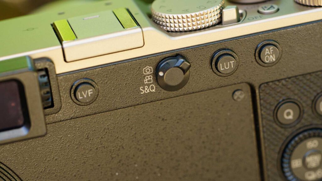 Detailed close-up of the Panasonic Lumix L10 rear panel showing the LVF button, LUT button, and S&Q mode selector.