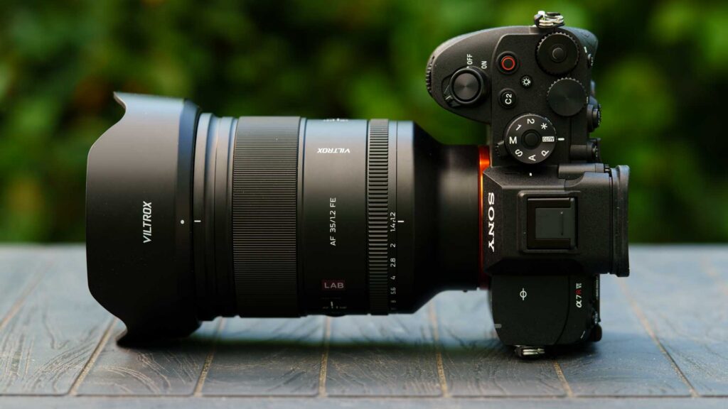 Top-down side view of the Viltrox AF 35mm F1.2 LAB FE mounted on a Sony Alpha 7R V, with hood, aperture ring and camera controls visible.