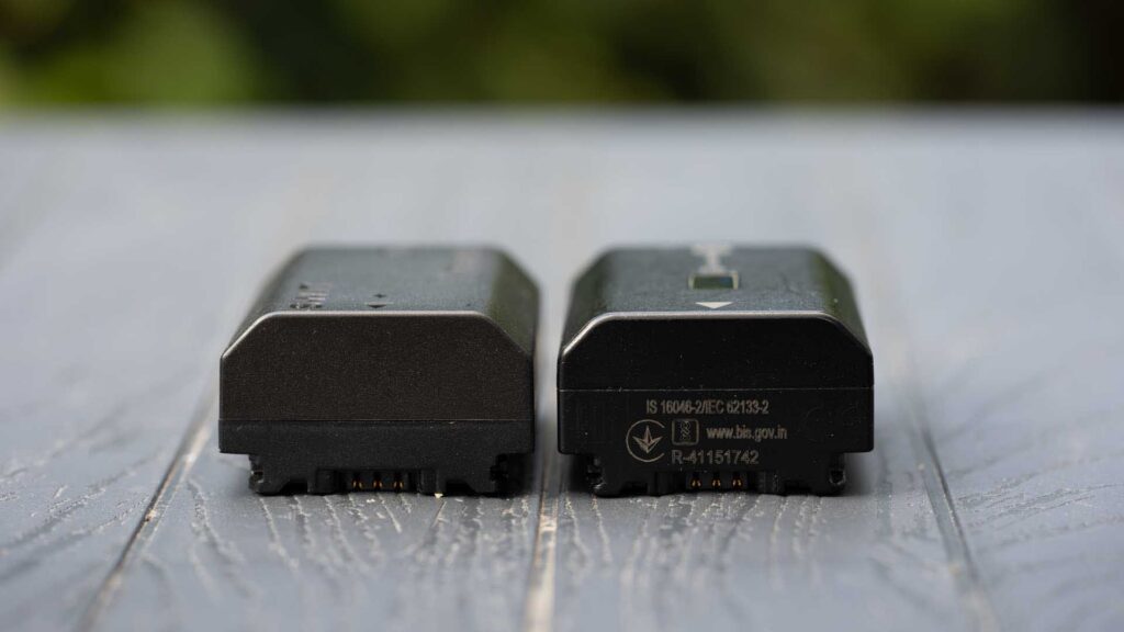 SWIT PowerCell and Sony NP-FZ100 batteries viewed from the contact end side by side, showing their similar shape and electrical terminals.