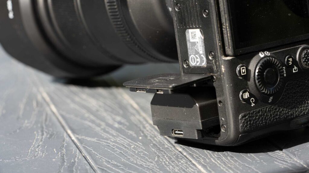 Swit NP-FZ100 PowerCell battery protruding from a Sony A7R IV camera