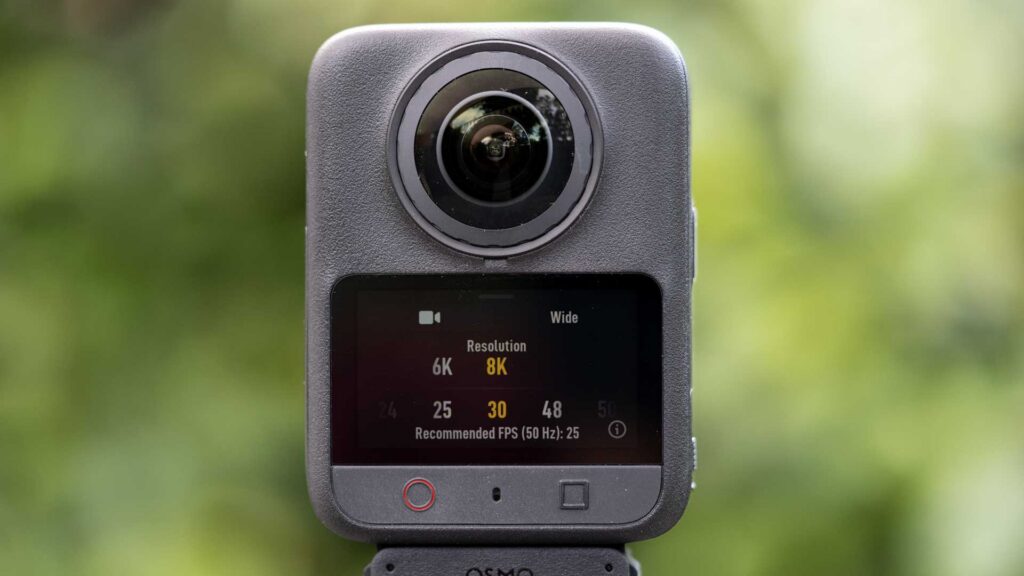 Front view of the DJI Osmo 360 II with the touchscreen showing Wide video resolution options, including 6K and 8K at 25 or 30fps.