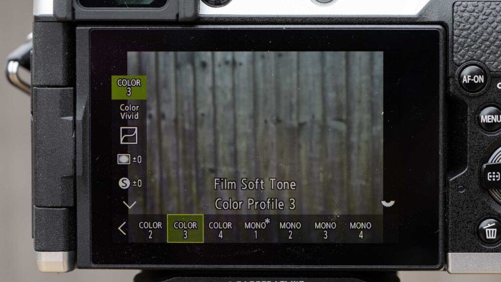 OM System PEN rear screen showing Film Soft Tone, Color Profile 3, with Color 2–4 and Mono 1–4 profile options along the bottom.
